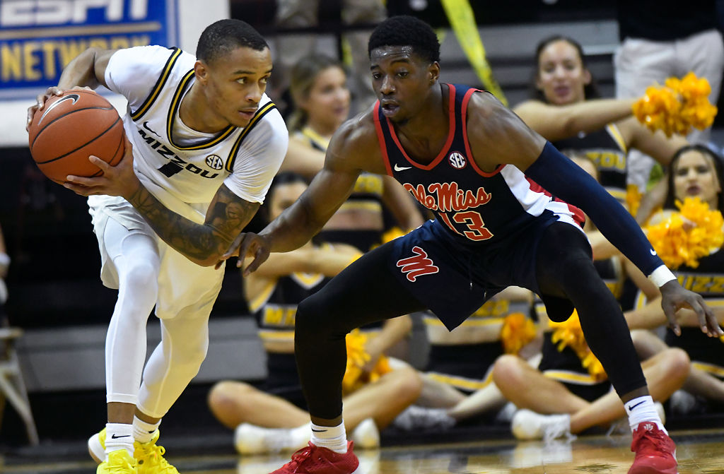 Missouri point guard Xavier Pinson protects the ball